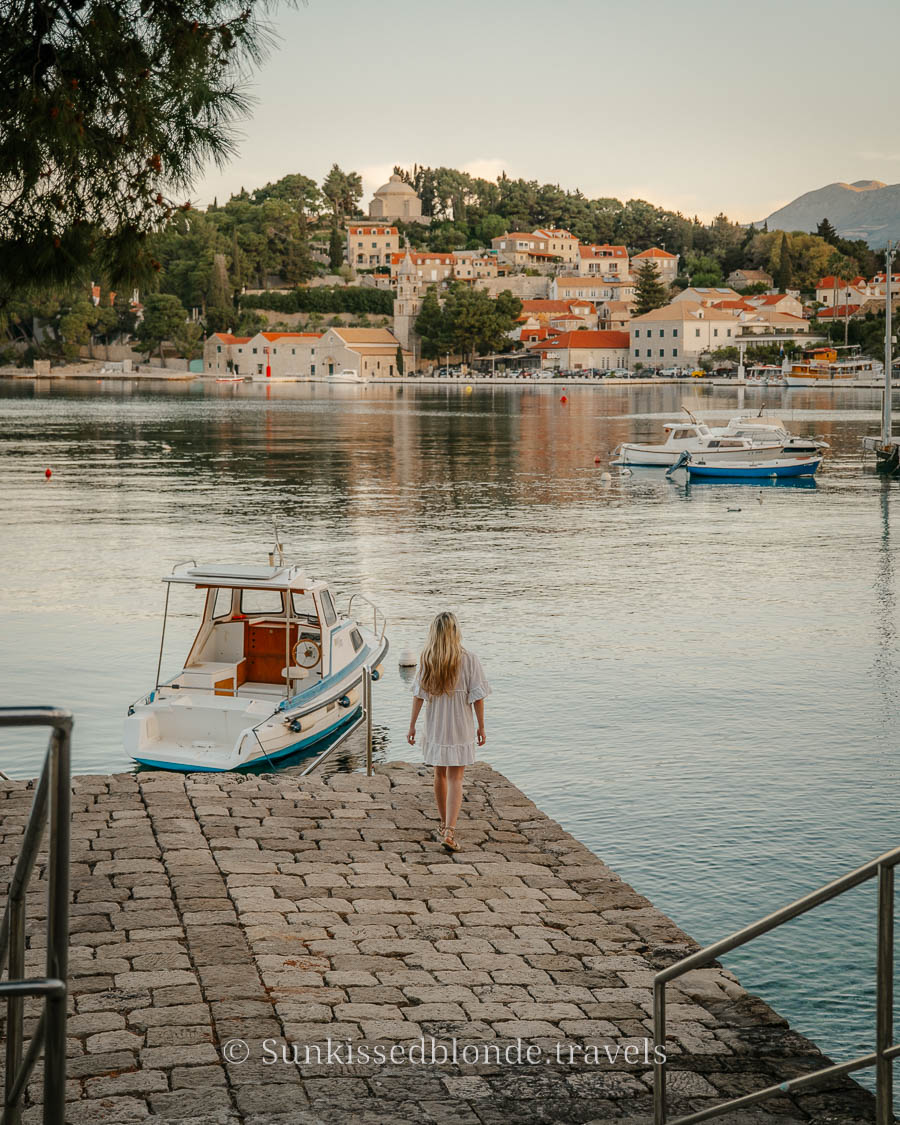 Laura Walking Down Pier in Cavtat Towards a Boat