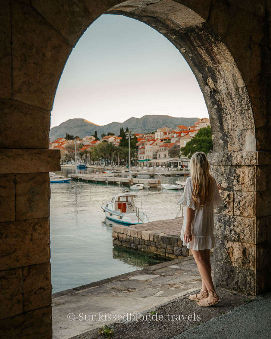 Laura Looking Over Cavtat Through An Archway